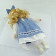 Laden Sie das Bild in den Galerie-Viewer, Puppe mit blau weißem Kleid / Porzellankopf & Stoffkörper / ca. 33 cm