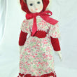 Laden Sie das Bild in den Galerie-Viewer, Mädchen mit Rot weißem Blumenkleid / Porzellankopf & Stoffkörper / ca. 45 cm