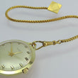Laden Sie das Bild in den Galerie-Viewer, Vintage Adora Taschenuhr Handaufzug mit Kette vergoldet 23cm