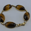Laden Sie das Bild in den Galerie-Viewer, Vintage Armband mit Tigerauge / 375er - 9 Karat Gelbgold / ca. 19,5 cm