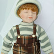 Laden Sie das Bild in den Galerie-Viewer, Junge mit brauner Latzhose / Porzellankopf & Stoffkörper / ca. 34 cm