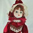 Laden Sie das Bild in den Galerie-Viewer, Puppe mit Rotem Kleid / Porzellankopf & Stoffkörper / ca. 47 cm