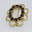 Laden Sie das Bild in den Galerie-Viewer, Vintage Brosche mit Granat - in Blumen-Optik / 333er - 8 Karat Gelbgold